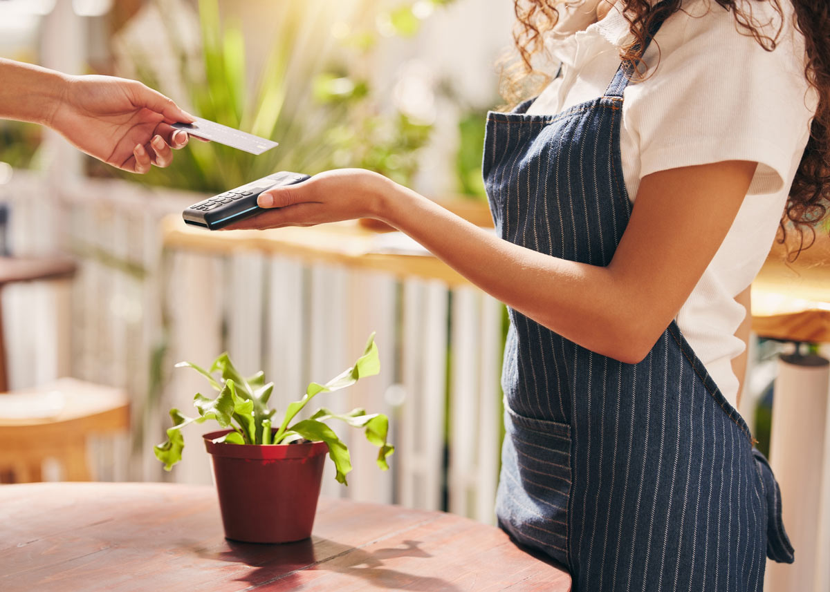 small business cashier accepting credit card payment
